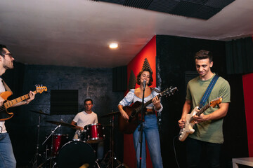 Music band rehearsing in a music venue