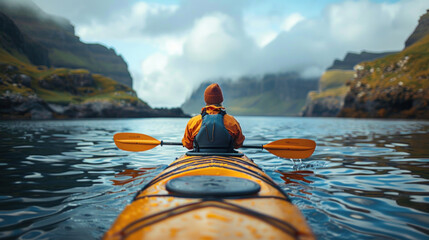 Backward view of traveler kayaking in the ocean. - obrazy, fototapety, plakaty