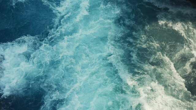 Static camera of a beautiful aqua blue river with raging white water rapids.