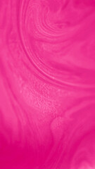 Fluid background. Paint swirls. Magic liquid flow. Defocused shimmering smooth texture pink ink...