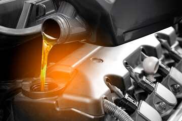 Refueling and pouring oil quality into the engine motor car Transmission and Maintenance Gear .Energy fuel concept.