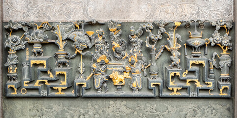 Detail of ornate art at the landmark Longshan Buddhist Temple in Taipei