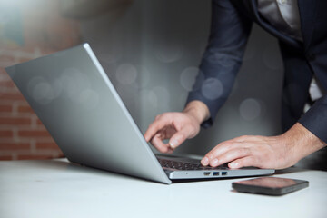 man using laptop computer on white background