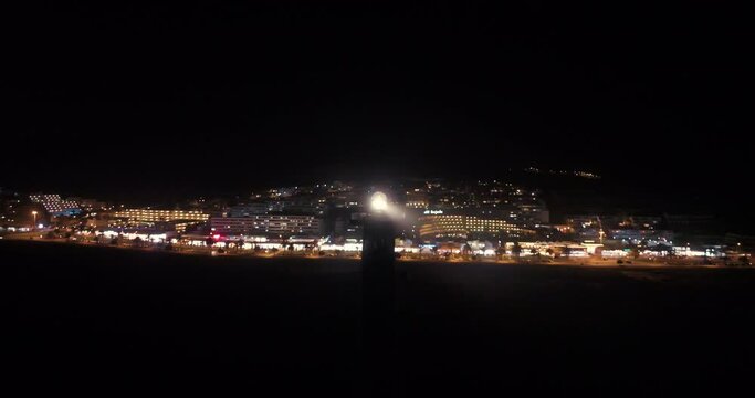 Jandia lighthouse at night aerial drone shot sky rocket