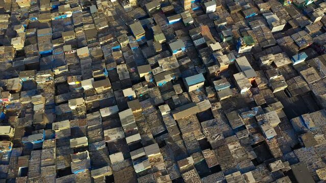 Drone rotating over the Dharavi favela, revealing the cityscape of Mumbai, India