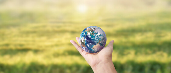 Globe ,earth in human hand, holding. Earth image provided by Nasa - 755339979
