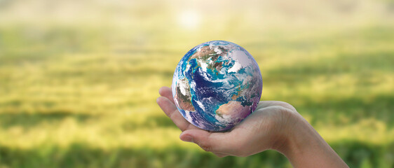 Globe ,earth in human hand, holding. Earth image provided by Nasa - 755340712