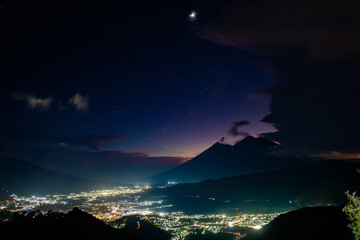 Antigua Guatemala city during sunset and the volcanoes that surround it
