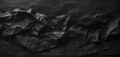 Crumpled Black Paper on Dark Background