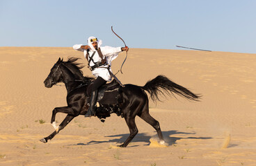 Horseback archery in a desert of Saudi Arabia