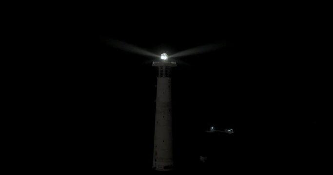 Jandia lighthouse at night aerial drone shot standing still