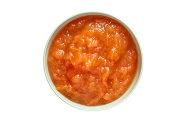 A bowl of fruit jam. Apple jam on a white background. Top view.