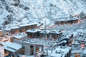 Fototapeta na wymiar Cityscape of the tourist town of Canillo in Andorra after a heavy snowfall in winter