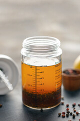 Italian vinaigrette sauce in shaker for sauces. Homemade salad dressing