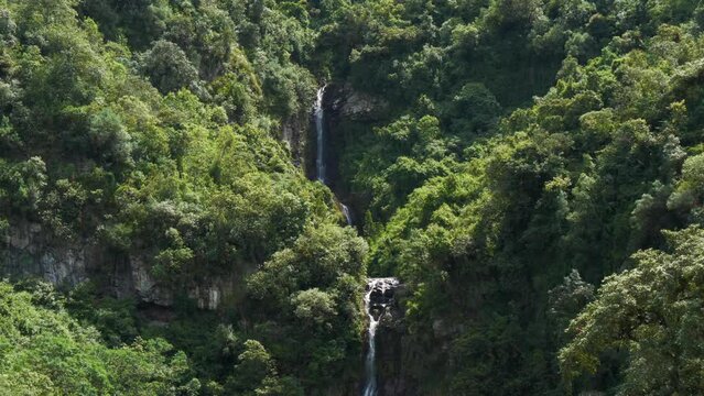 beautiful waterfall of double fall in the middle of the mountain with lush vegetation located in the puichig neighborhood in the city of machachi, in the province of pichincha, Ecuador.