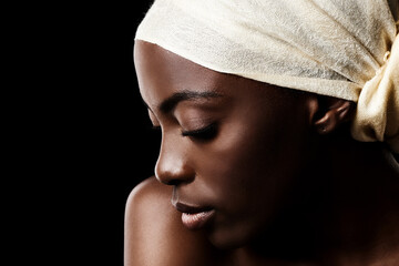 Beauty, relax and black woman in studio with headscarf, natural makeup or creative aesthetic. Art, skincare and African girl on dark background with head wrap, facial cosmetics and culture in profile