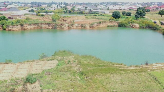 A lake formed by a natural dam near Jos, Nigeria - aerial orbit parallax