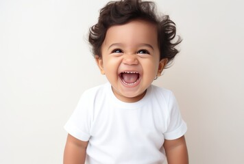 Adorable Baby Laughs Joyfully - obrazy, fototapety, plakaty