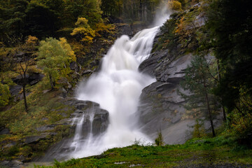 Fototapeta na wymiar A powerful waterfall during the rain in Zwischbergen, Switzerland, near Italian border