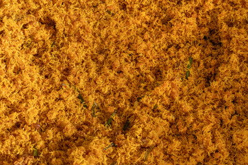 Serundeng or saur, spicy Indonesian coconut flakes, is made from grated coconut sauteed with spices such as shallots, chilies, garlic, coriander, turmeric, sugar, tamarind, bay leaves and galangal.