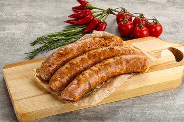 Raw sausages with spices and herbs