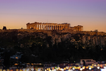 Fototapeta premium The Parthenon Temple at the Acropolis of Athens, Greece, during colorful sunset