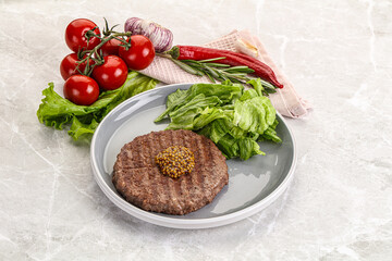 Frilled beef burger cutlet with iceberg