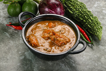 Indian cuisine - chicken curry with spices