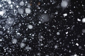 Falling snow on the black background. 