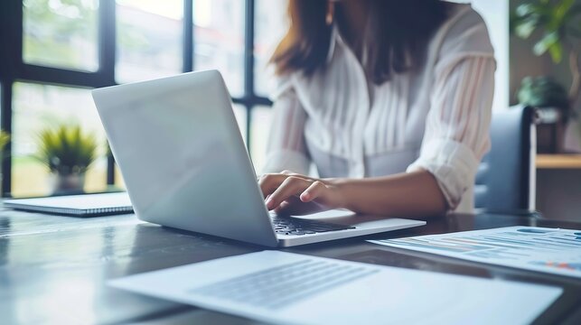 Generative AI : Women work on laptop on the table at the office with information documents.