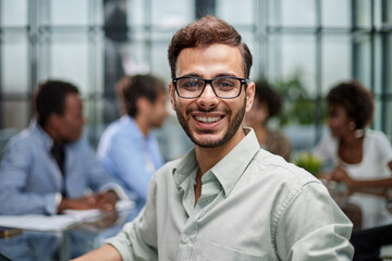 business man with executives working in background