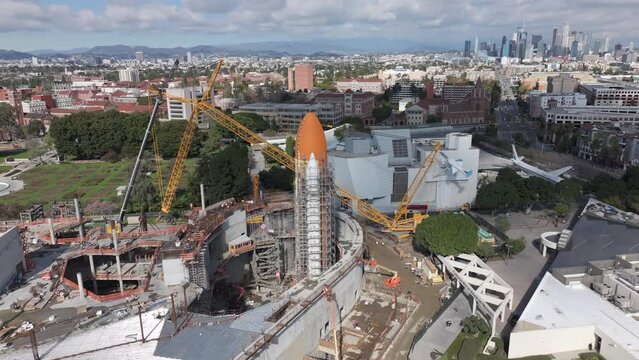 Space Shuttle Endeavor during construction in Los Angeles at the Science Center, aerial orbiting