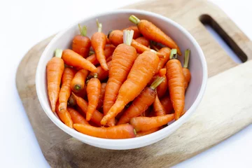 Fototapeten Fresh baby carrot, Excellent source of vitamin A and beta-carotene © Bowonpat