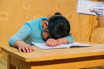 latina girl tired from schoolwork - health concept