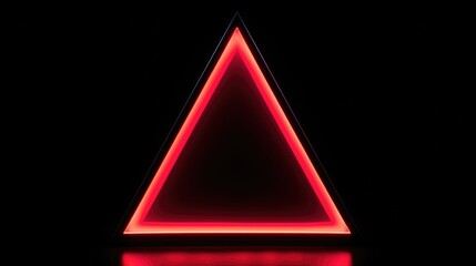A triangle shaped object glowing in the dark, suitable for technology concepts