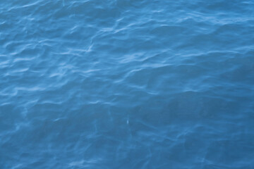 Blue sea water background. Texture of the water surface with ripples