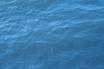 Obraz premium Blue sea water background. Texture of the water surface with ripples