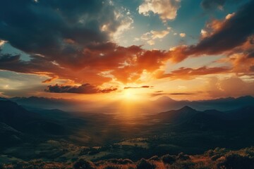 Scenic view of the sun setting over a majestic mountain range. Perfect for travel and nature concepts