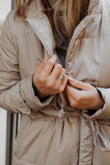 Woman in Coat Wearing Ring