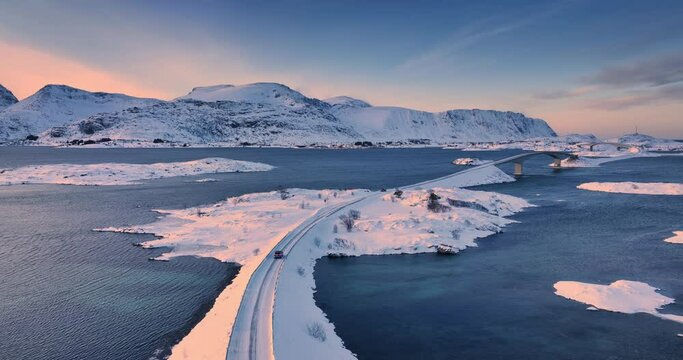 Sunrise winter panorama over norwegian sea shore and Fredvang bridge, Reine, Lofoten islands, Norway video
