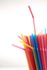colorful plastic straws in a cup