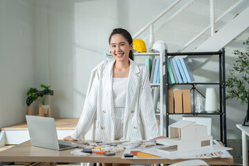 Portrait of Happy young Asian businesswoman looking at camera,arms crossed folded.Smiling woman...