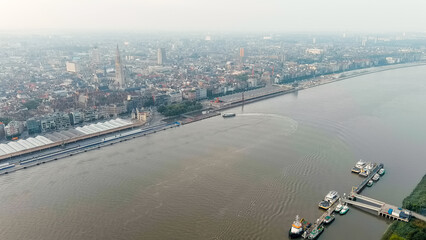 Antwerp, Belgium. River public transport on the river Scheldt (Escaut). Embankment of Antwerp....