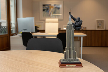 an empire state building statue in front of an office desk