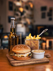 Juicy hamburger served with fries - 755423117