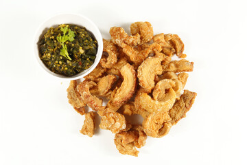 Homemade crispy pork rind isolate on white background. Local food of northern Thailand.