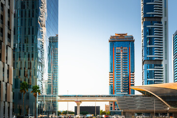 Dubai downtown with modern skyscrapers and metro station. Dubai, United Arab Emirates.
