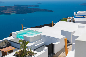White architecture in Santorini island, Greece. Swimming pool with sea view