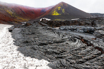 Volcano craters and black lava fields near Tolbachik volcano in Kamchatka, Russia.