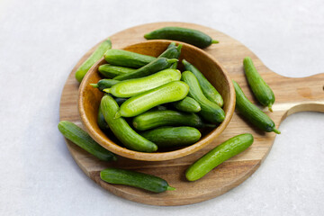 Mini cucumbers on white background.
